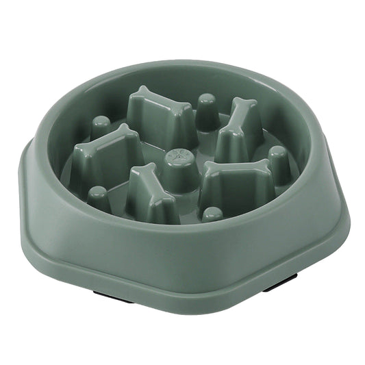 Green dog food bowl with raised sections on a white background