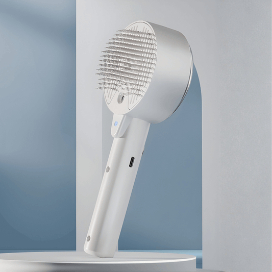 White handheld shower head on a gray background