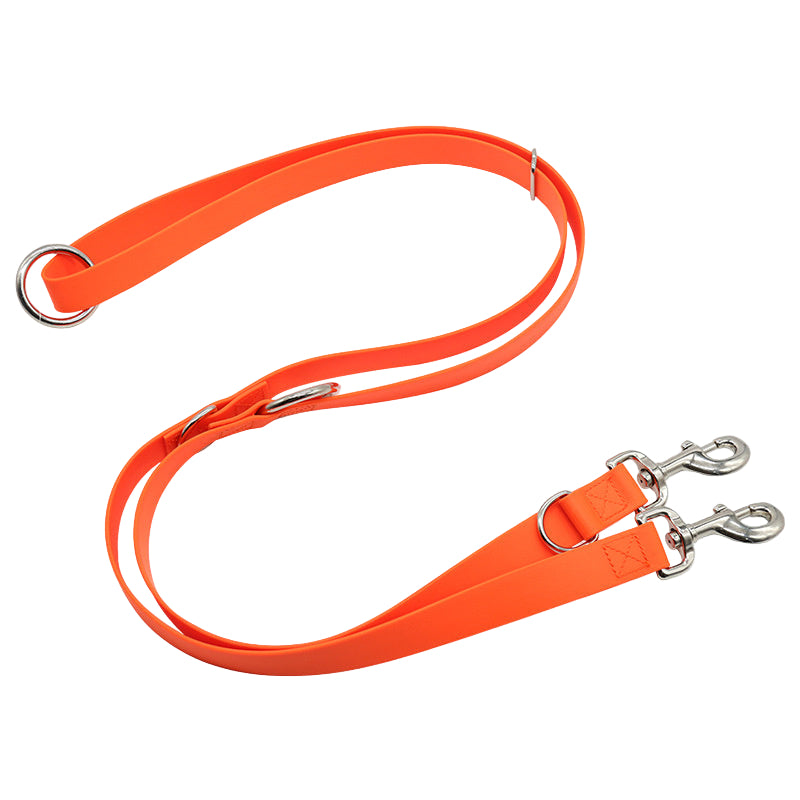 Orange dog leash with metal clips on a white background