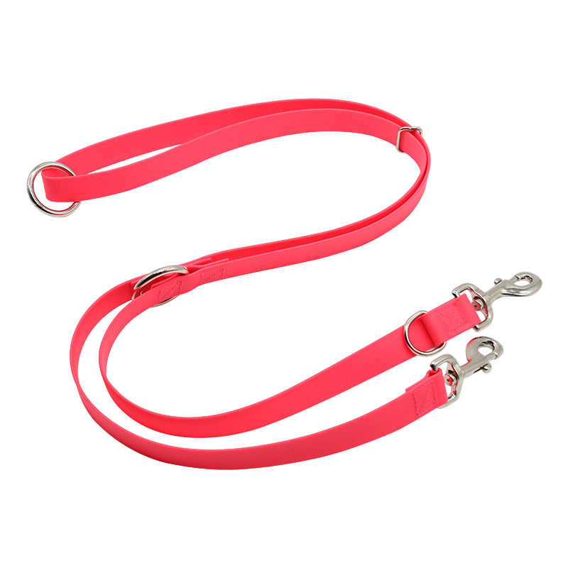 Pink dog leash with metal clips on a white background